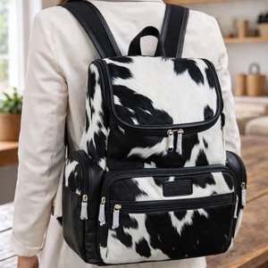 Luxury cowhide leather hair on student <b>backpacks</b> wholesale OEM supplier custom logo export quality school bags for sale - Product Image 1