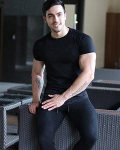 เสื้อยืดแมนส์ยิม พิมพ์ลายโลโก้ด้านหลังแบบกำหนดเอง คุณภาพสูง พิมพ์ดิจิทัล เป็นมิตรกับสิ่งแวดล้อม ผ้าฝ้าย 100% ทรงหลวม ไซส์พลัส สำหรับผู้ชาย - Product Image 5