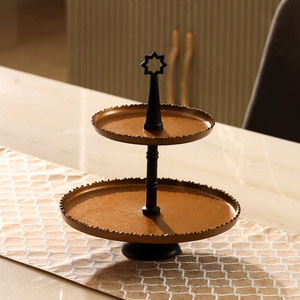 Exquisite Two Tier Golden <b>Cake</b> <b>Stand</b> With Textured Trays And A Sleek Black Central <b>Stand</b> Finished With A Star Top For Serving - Product Image 1
