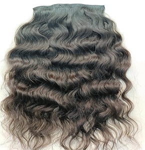 Cabello humano Remy indio sin procesar 100% | Extensiones de cabello ondulado con clip Color negro natural, sin enredos | Suministro a granel al por mayor - Product Image 1