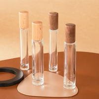 Vente en gros de flacons de parfum portables miniatures rechargeables en verre de 10 ml et 15 ml, avec vaporisateur et atomiseur, couvercle en bois, pour échantillons de parfum