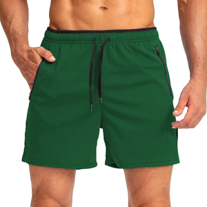 Shorts de sport bleus pour hommes à séchage rapide avec poches zippées, taille à cordon de serrage, longueur mi-cuisse, couleur unie, tissu tricoté - Product Image 4