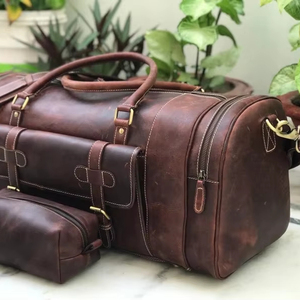 กระเป๋าเดินทางหนังแท้คุณภาพส่งออก สไตล์วินเทจ สำหรับวันหยุดสุดสัปดาห์  แบบ unisex น้ำหนักเบา ความจุมาก พร้อมซิป ขายส่ง - Product Image 1