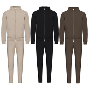 Elite zip-up <b>tracksuits</b>. Bold contrast shoulder panels. sleek <b>white</b> piping. and tapered joggers for a sharp. athletic look. - Product Image 1