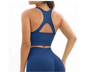 Venta al por mayor directa de fábrica: Conjunto deportivo de 2 piezas para mujer, acanalado, sin costuras, transpirable, con sujetador deportivo y shorts de cintura alta, OEM. - Product Image 4