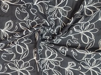 Tissu en coton noir de jais en gros avec broderie florale blanche et travail de cordon 3D pour vêtements de créateurs et décoration intérieure