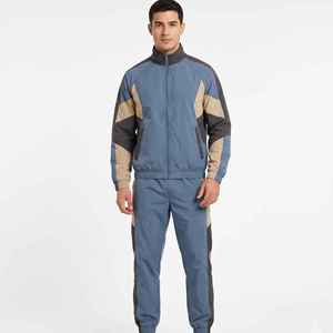 Conjunto deportivo de 2 piezas, chaqueta cortavientos holgada personalizada, ligera, de nailon liso, para hombre. - Product Image 1