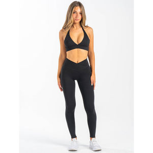 Nouvel ensemble de sport 2 pièces pour femme avec logo personnalisé OEM : Leggings noirs à taille croisée et soutien-gorge – Ensemble de yoga et fitness respirant - Product Image 1