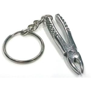 Porte-clés d'instruments dentaires : Mini forceps d'extraction et détartreur en acier inoxydable de haute qualité, étanche et personnalisable - Product Image 1