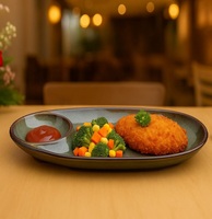 Assiette de service ovale en céramique avec compartiments séparés pour aliments et sauces, design minimaliste, passe au lave-vaisselle