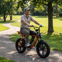 Vélo électrique à roulement fluide avec amortisseurs avancés, vélo électrique à pneus larges orange pour les trajets alternatifs sur les terrains de golf