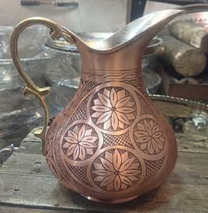Vintage <b>copper</b> pitcher showcasing a beautiful traditional floral motif and brass <b>handle</b>, available at wholesale price - Product Image 1