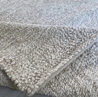 Tapis moderne abstrait en laine feutrée de style corde beige crème, tissé à la main par HARI ENTERPRISES |   Écologique, antibactérien, adapté aux animaux de compagnie