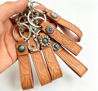 Porte-clés en cuir de cowboy personnalisé, créatif, faible MOQ, qualité assurée, exquis, durable, avec bracelet de poignet