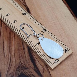 Boucles d'oreilles ovales en nacre polie, bijoux artisanaux naturels, objets de collection, pour soirée, par Curio Craft - Product Image 2