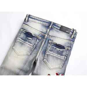 สร้างความโดดเด่นด้วยงานปักลายนกและธรรมชาติที่ได้รับแรงบันดาลใจจากแบรนด์ของเรา บนกางเกงยีนส์ปักลายสุดพิเศษนี้ - Product Image 5