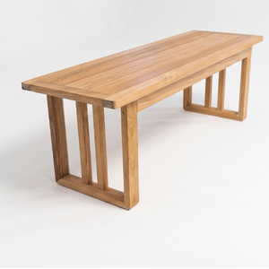 Solid wood dining <b>table</b> featuring a minimalist design, slatted pillar <b>legs</b>, an architectural look, and rot-resistant properties. - Product Image 1