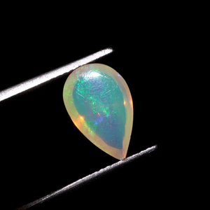 พลอยโอปอลไฟสีขาวธรรมชาติ HAYAAT GEMS รูปทรงลูกแพร์เจียระไนแบบคาโบชอง น้ำหนัก 1.50 กะรัต พร้อมสีสันเปลี่ยนแปลง - Product Image 6