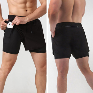 Shorts de compression pour homme, couleur unie, avec poches, séchage rapide, taille élastique, longueur mi-cuisse, en spandex et polyester, design tricoté - Product Image 3