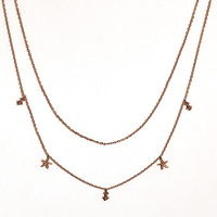 Collier double rangs empilable polyvalent Gemnel avec mini-breloques étoile de mer en zircon cubique pour un style superposé