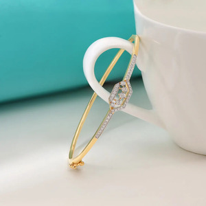 Geometric <b>Frame</b> Diamond Bangle with Yellow Gold Slim Band and <b>Floating</b> Triple Stone Center Design - Product Image 4