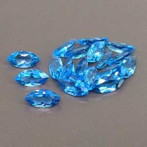 บลูโทแพซธรรมชาติจากสวิสทรงมาร์คีส์เจียระไนแบบเฟสเซต  ขนาดมาตรฐาน  พร้อมใบรับรอง  ไม่ผ่านการปรับแต่ง  พร้อมสำหรับการฝังในเครื่องประดับ - Product Image 1