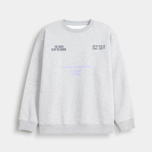 Sweat-shirt ample à épaules tombantes avec ourlet brut et motifs graphiques rétro imprimés - Product Image 1