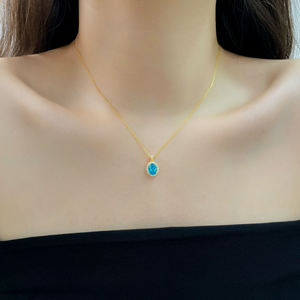 AMBER JEWELS Collier Pendentif Classique Ovale Diamant Bleu Plaqué Or 18K Chaîne Unisexe Bijou Cadeau pour Pierre de Naissance d'Avril - Product Image 1