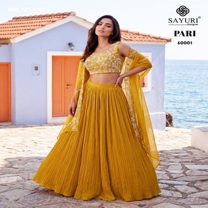 Vêtements ethniques en soie chinon, lehenga évasé uni - Ensemble prêt-à-porter indo-occidental avec blouse et koti brodés à la main, achat en ligne en Inde - Product Image 1