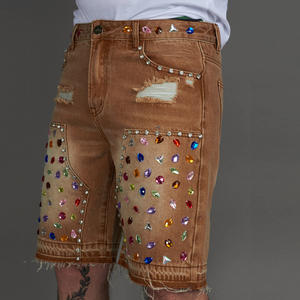 Pantalones cortos de mezclilla marrón de alta calidad con paneles dobles de rodilla personalizados con múltiples pedrerías, pedrería grande y cortes clásicos, lavado vintage y peso pesado. - Product Image 1
