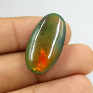 โอปอลเอธิโอเปียสีดำธรรมชาติ 22.00 กะรัต แบบคาโบชอง หลายสี ไฟหลากสี ผิวเรียบ ไม่มีตัวเรือน ใช้เป็นพลอยประจำเดือนตุลาคม ขนาด: 29X16X9 มม. - Product Image 4