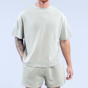 เสื้อยืดคอกลมแขนสั้นทรงโอเวอร์ไซส์สีพื้นผ้าฝ้ายสำหรับผู้ชาย รุ่นเรกูลาร์ ลองธ์  2026 - Product Image 2