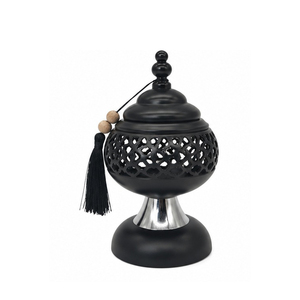Brûleur d'encens en métal noir avec pompon et design perforé pour l'aromathérapie - Product Image 1