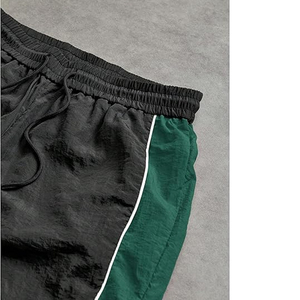 กางเกงวอร์มไนลอนทรงหลวมคุณภาพสูงสำหรับผู้ชาย กางเกงกันลมกันยับ เอวยางยืด มีเชือกผูก เหมาะสำหรับกีฬากลางแจ้ง - Product Image 4