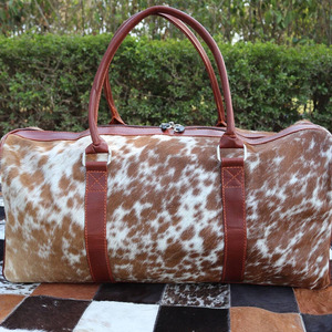 Premium cowhide leather hair on travel <b>bags</b> wholesale supplier OEM custom logo handmade export fashion luggage <b>bags</b> for sale - Product Image 6