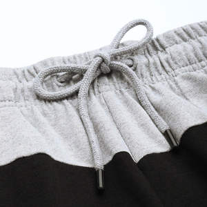 Shorts pour hommes bicolores gris et noir en tissu à séchage rapide, vêtements de plage et de sport tendance - Product Image 1