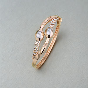 Rose gold plated ladies <b>bangle</b> with dual oval <b>charm</b> chic designer womens jewellery stylish lightweight bracelet - Product Image 1