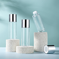 Flacon transparent avec bouchon à vis argenté métallique pour tonique facial et eau, avec réducteur intégré