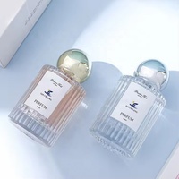 Flacon de parfum cylindrique de luxe personnalisé de 30 ml et 50 ml avec bouchon doré à bille, surface estampée à chaud pour flacon de parfum en verre