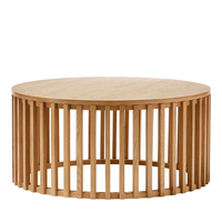 Table basse ronde en bois massif de style moderne et luxueux avec base à lattes verticales pour hôtel, salon, appartement