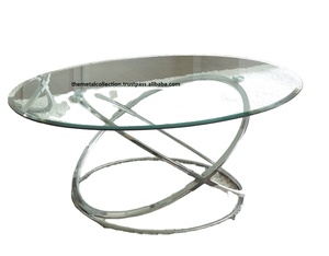 โต๊ะเฟอร์นิเจอร์โลหะสุดสร้างสรรค์พร้อมกระจกด้านบนสำหรับห้องนั่งเล่นโรงแรมร้านอาหารสีเงินตกแต่งรูปวงรีตรงกลางและโต๊ะด้านข้าง - Product Image 1