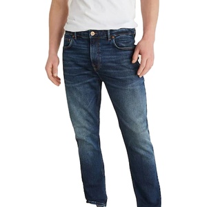 Jeans homme coupe droite en denim de coton délavé, couleur personnalisée, avec boutons métalliques et effet whiskers - Product Image 1