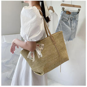 Capture the spirit of modern city life with this stylish Natural yarn bag featuring a structured <b>body</b> and an embroidered <b>bow</b> - Product Image 2
