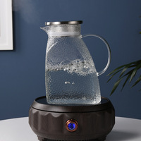 Vente en gros de carafes à eau en verre borosilicate de haute qualité personnalisées de 1500 ml et 1800 ml avec couvercle en métal pour le thé et le café