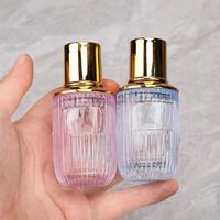 Flacon de parfum en verre transparent de luxe 50ml/100ml avec pulvérisateur à écran sérigraphié, logo personnalisé, emballage en carton pour parfum