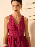 Ensemble coordonné haut peplum à œillets fuchsia et short ajusté pour femme