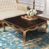 Table basse en acajou luxueuse avec des accents de feuille d'or