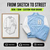 Ensemble de survêtement personnalisé OEM pour homme, bleu pastel, avec veste coupe-vent en nylon à manches contrastantes et pantalon de jogging style collage avec lettres en chenille – Fabrication usine