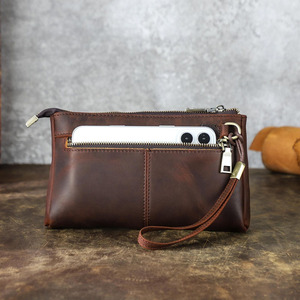 Pochette en cuir véritable avec fermeture éclair de qualité supérieure, compartiments intérieurs bien organisés et design élégant, à vendre - Product Image 1