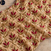 Tissu de robe brodé de fleurs avec des motifs de feuilles métalliques dorées et du fil bordeaux |   Tissu à paillettes pour robes de mariée et tenues de soirée
